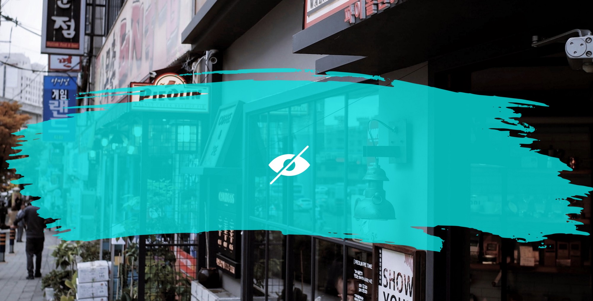 Header Image showing a view of a street but blocked with a brush stroke.