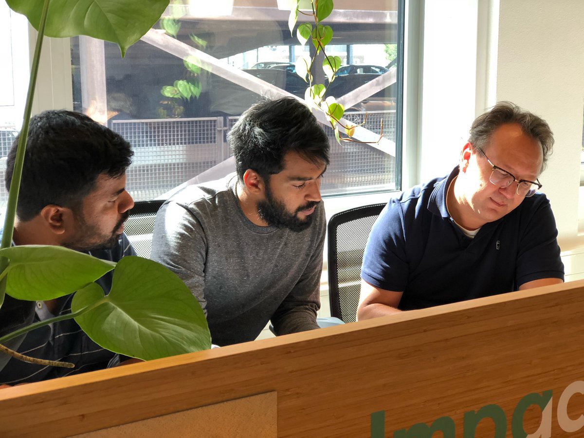 Caption: Founders of Envision, Karthik and Karthik, brainstorming with Olaf from the City of Hague.