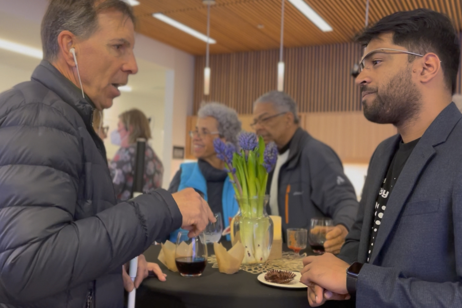 Karthik Mahadevan talking to an attendee at Inclusive Innovations 2023.
