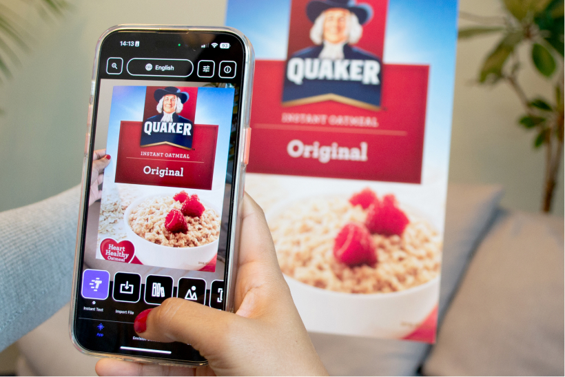 A person scanning a document with the Envision App on their phone