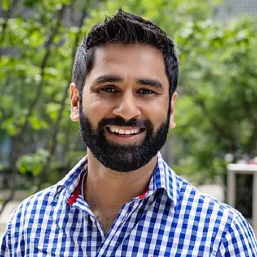 Photo of Amit Patel wearing a checkered shirt.