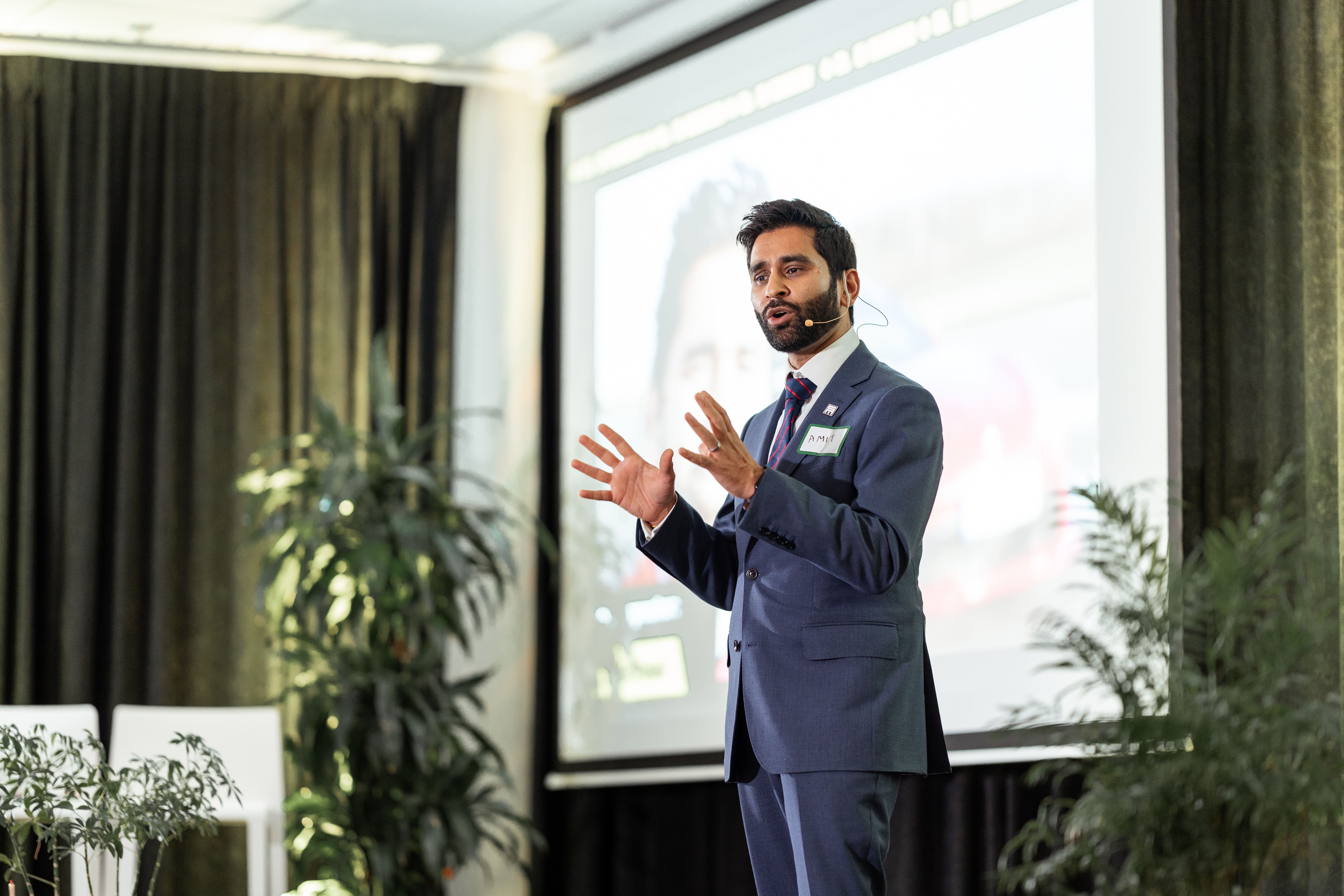 Doctor Amit Patel giving the keynote speech on the ININ stage