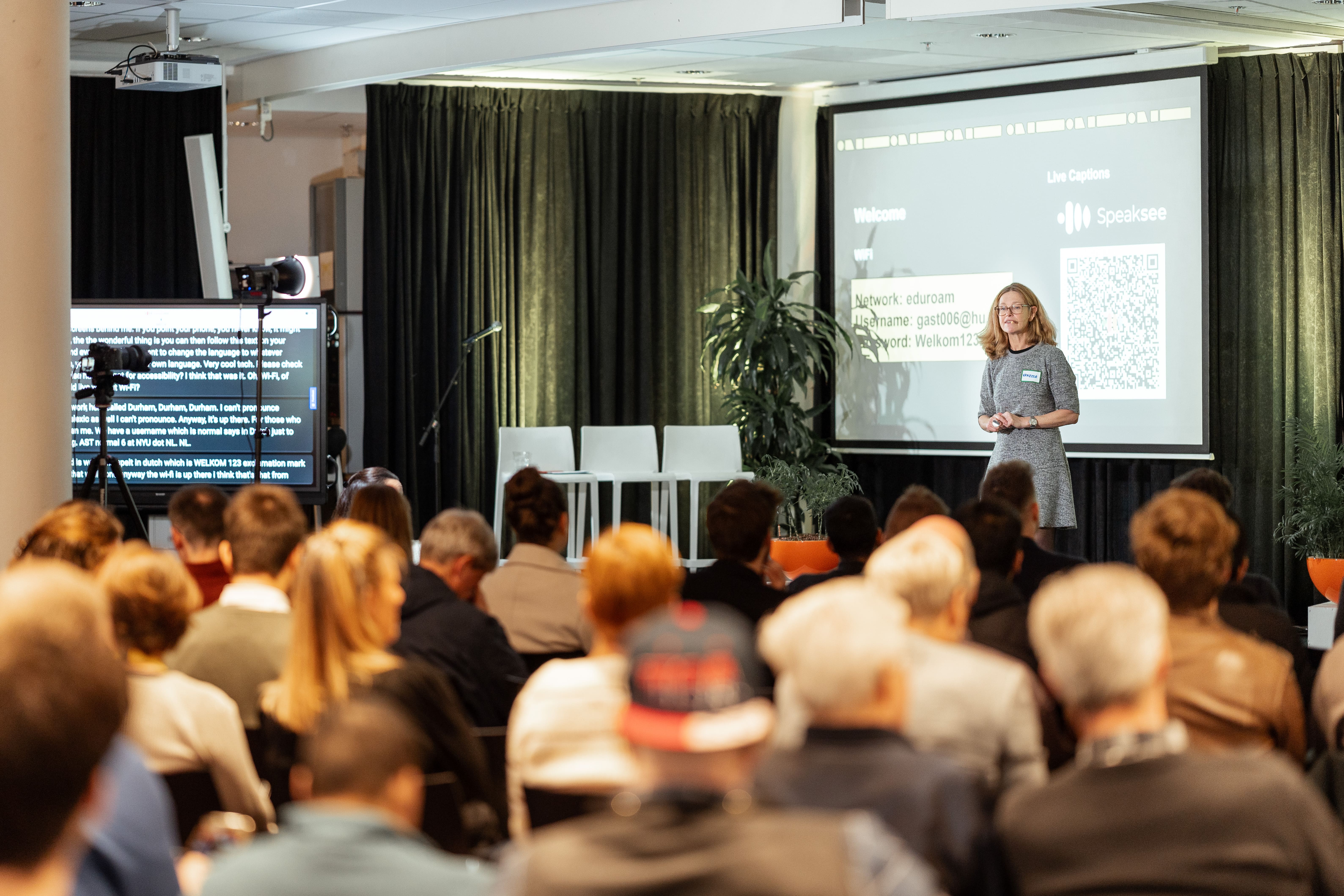 Vanessa from Envision giving a speech on the ININ stage