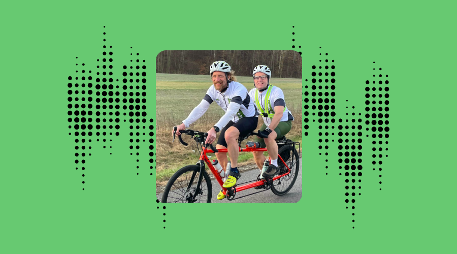 a photo of dave wilkinson on a tandem bike wearing the envision glasses