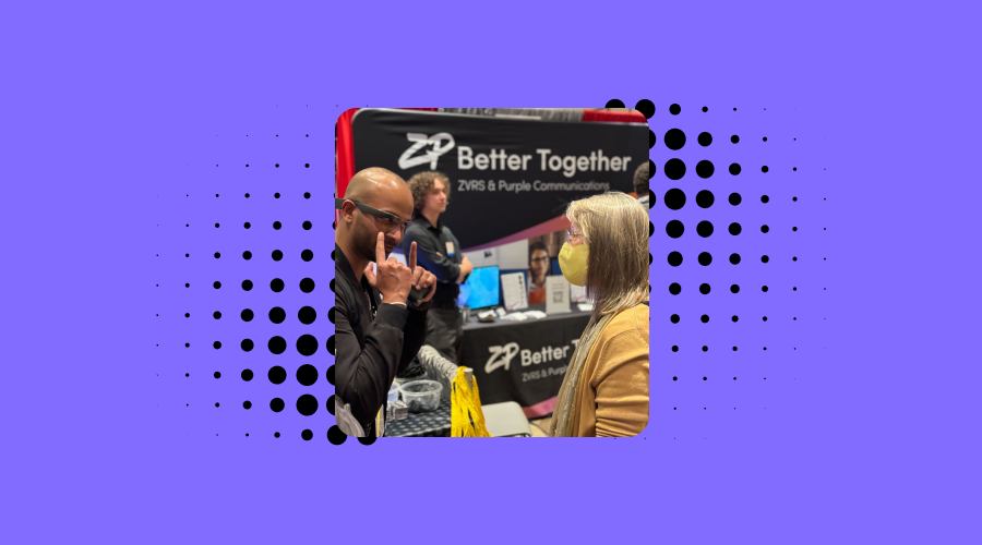 Bhagya from envision demonstrates ask envision to a booth visitor at csun.