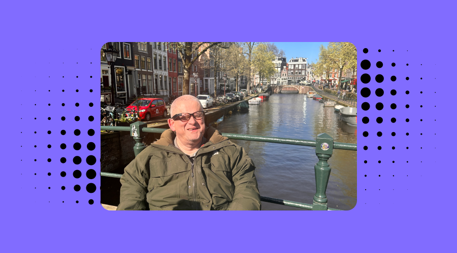 Envisioner Brian visiting amsterdam he is seen posing in front of a bridge wearing envision glasses.